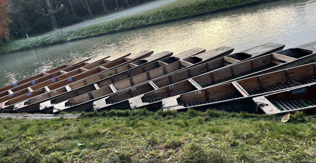 Row of self hire punts on river